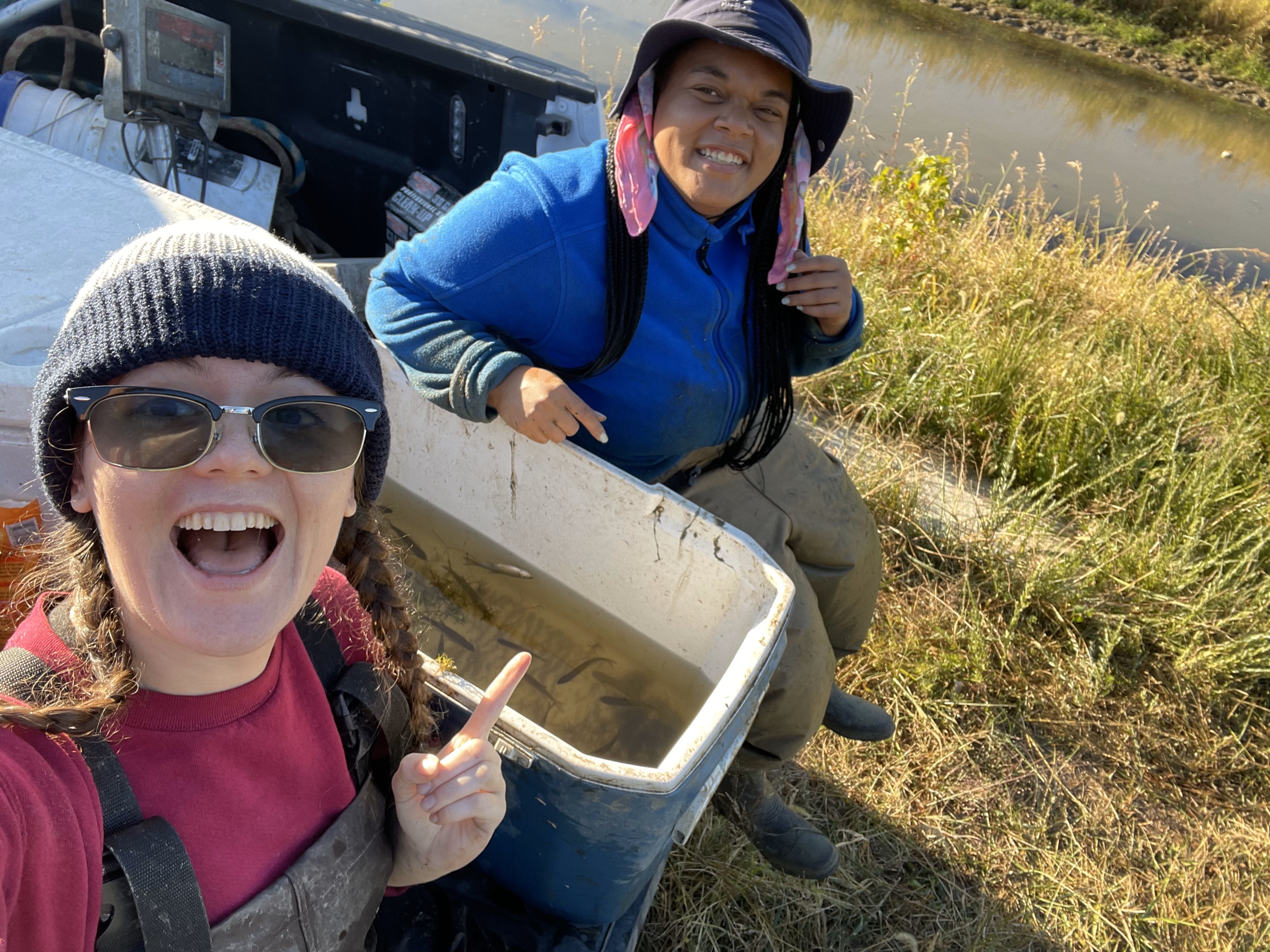 Selfie with two girls on a truck with a cooler of fish